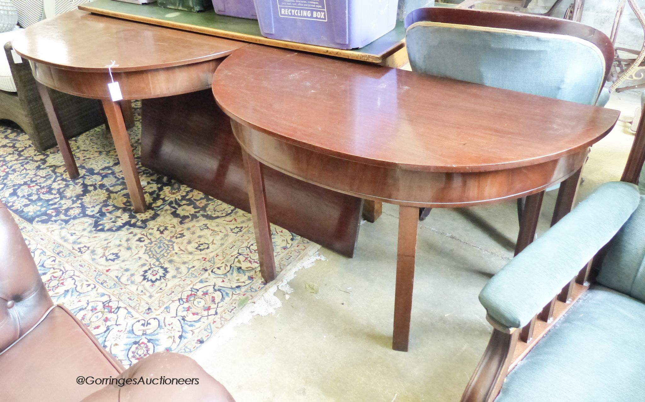 A George III mahogany D end dining table with one leaf. W-174cm extended. W-132cm, H-71cm.